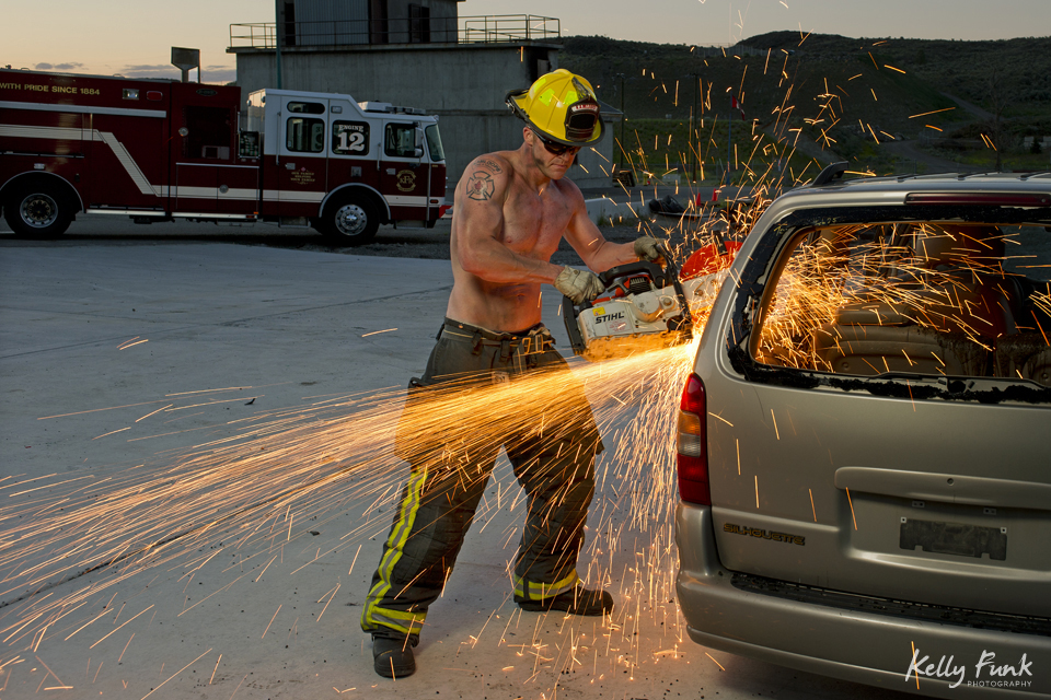 Portrait of a firefighter with a chop saw in Kamloops, British Columbia, Canada