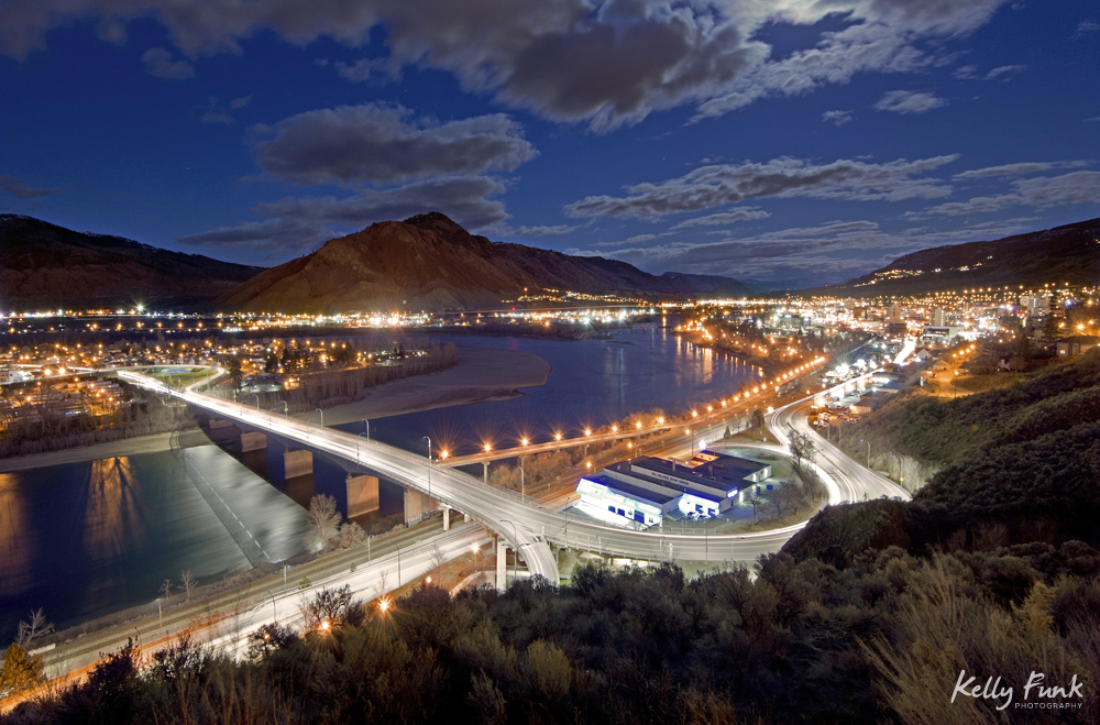 The city of Kamloops at dusk and city lights with the north and south Thompson rivers, Thompson Okanagan region, British Columbia, Canada