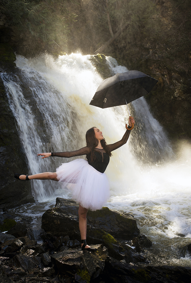 Portrait of a beautiful young ballerina in a pose at Chase falls, Chase, BC, Shuswap region, Canada