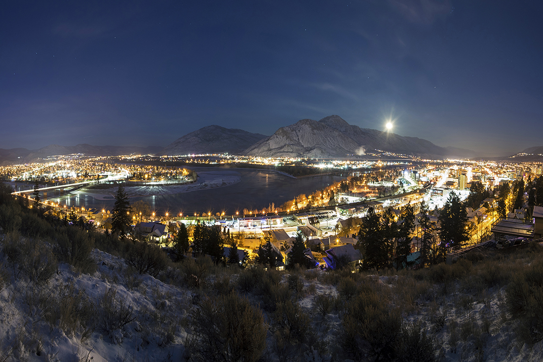 City of Kamloops, BC, Canada at night with lights and moon