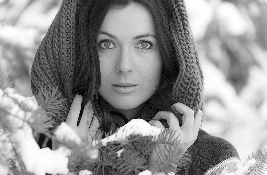 Portrait of a young, beautiful woman in the snow covered forest near Kamloops, British Columbia, Thompson Okangan region, Canada