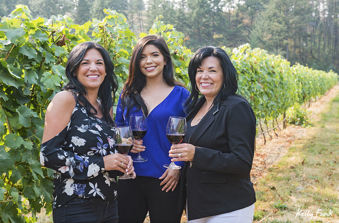 Mother and daughters at the vineyard of Kelowna's Indigenous World Winery during a commercial shoot, British Columbia, Canada