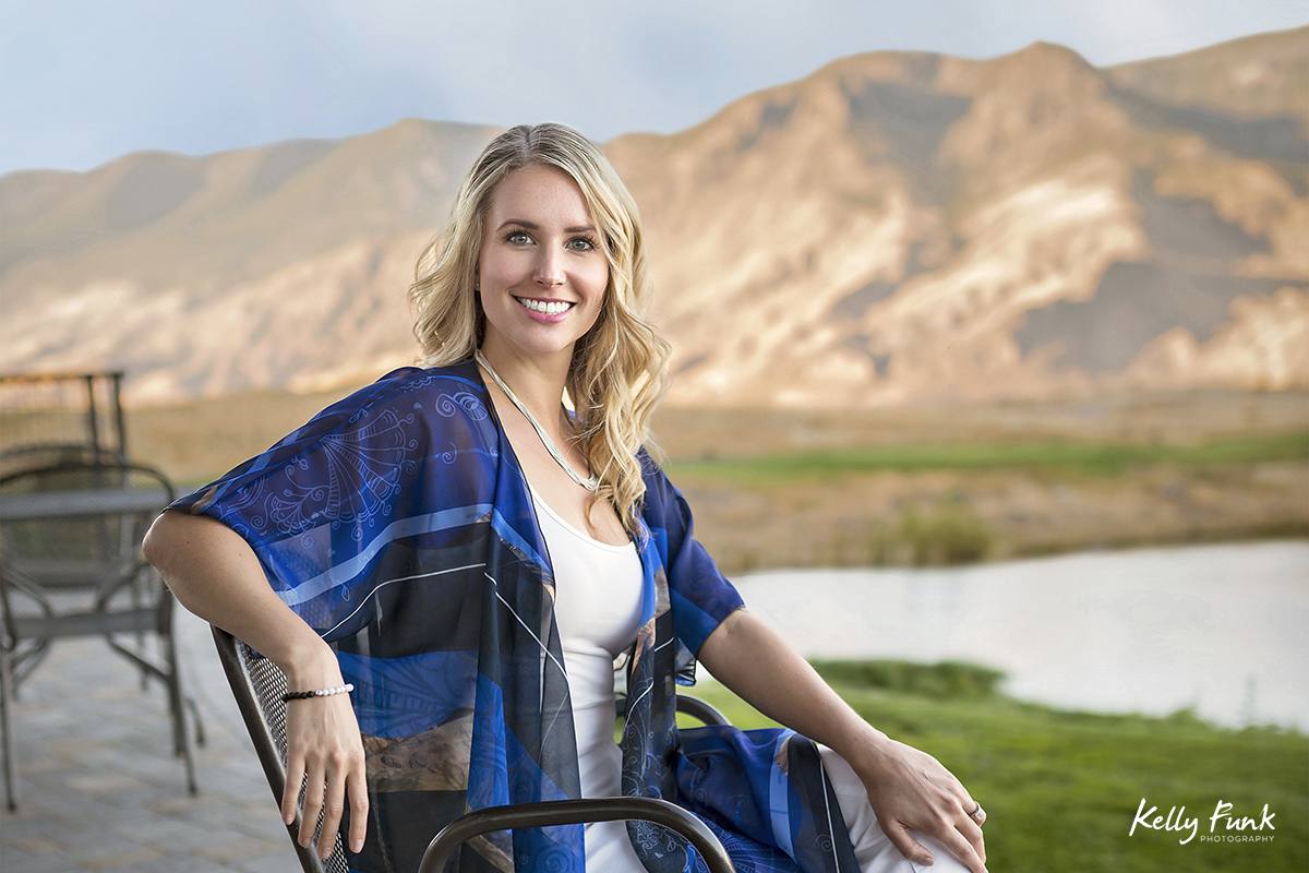 A beautiful woman poses during a commercial fashion shoot for lifestyle active wear at sunset near Kamloops, British Columbia, Canada