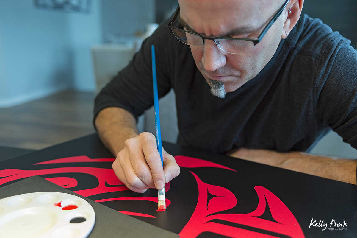 A Kamloops artist works on one of his First Nation paintings, British Columbia, Canada