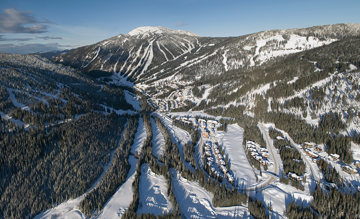 Aerial photograph in a helicopter of Mt. Morrissey, Tod mnt and the Village at Sun Peaks Resort during a tourism marketing shoot, British Columbia, Thompson Okanagan region, Canada