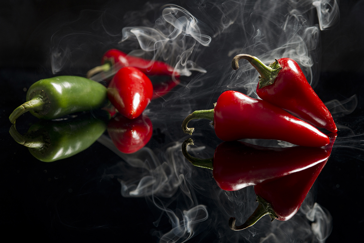 Smoking red peppers during a conceptual shoot, British Columbia, Canada