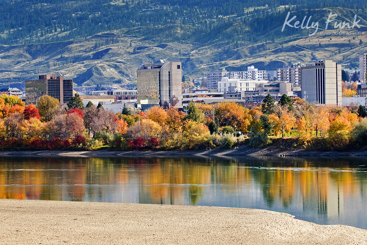 Kamloops city is reflected in the Thompson river on a beautiful fall day, British Columbia, Canada