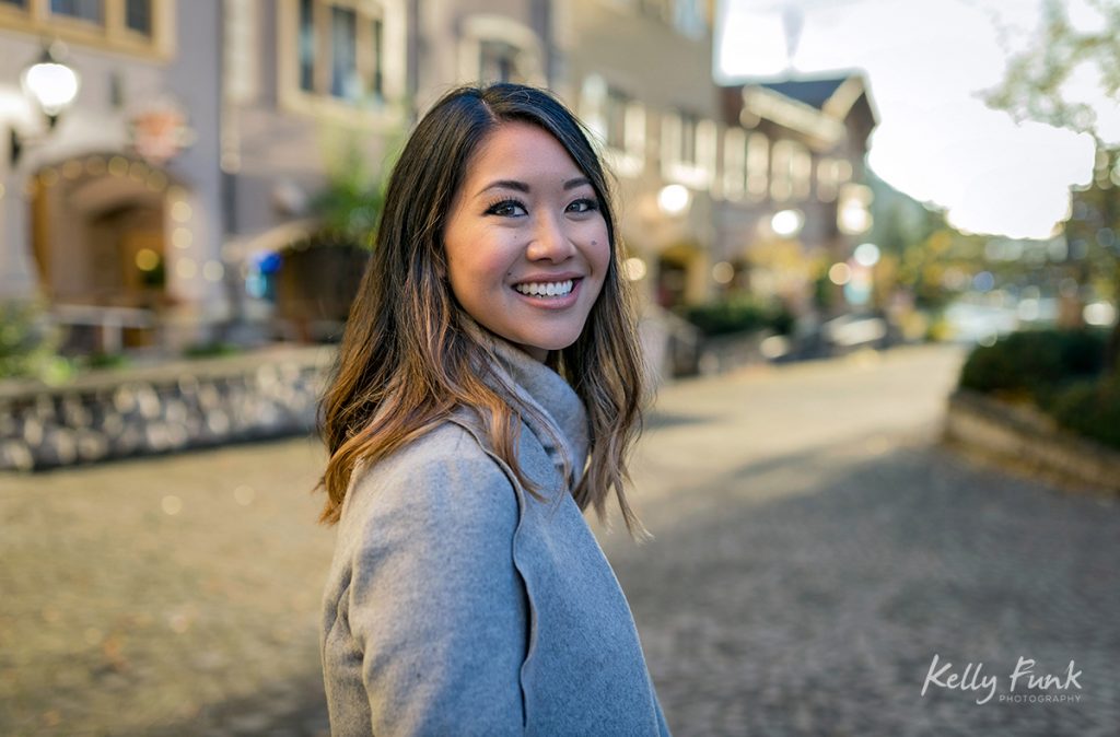 A beautiful woman poses for a portrait in the village of Sun Peaks Resort, British Columbia, Canada