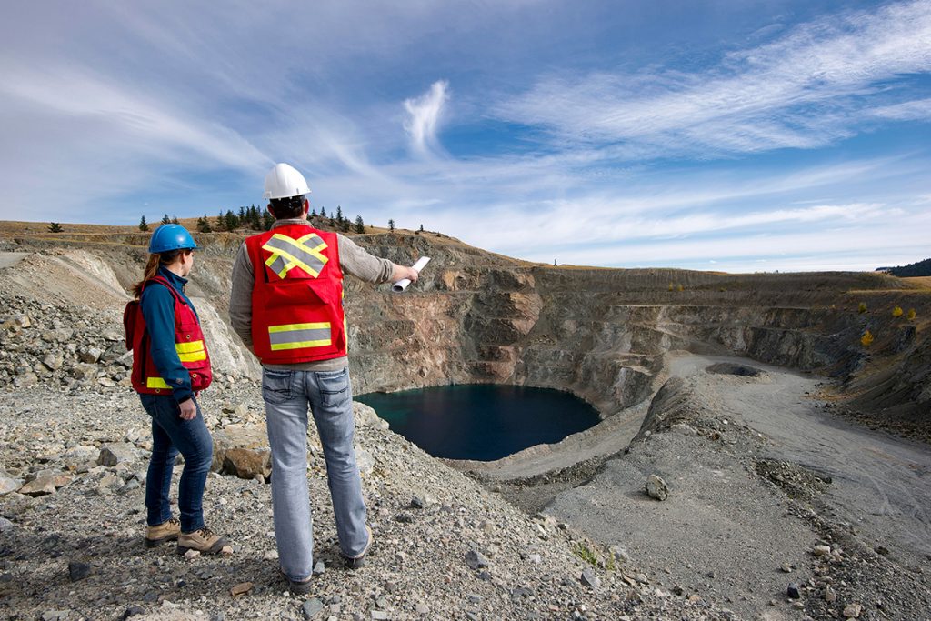 Mining consultants talk about logistics at a mine site near Kamloops, British Columbia, Canada