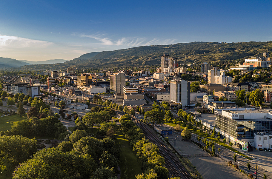 Kelly Funk Kamloops city center at sunrise An aerial drone image for Colliers Canada of the downtown core at Kamloops during first light in early summer in the Thompson Okanagan region of British Columbia Canada, available as a large-scale corporate print or commercial stock image by Kelly Funk Photography.
