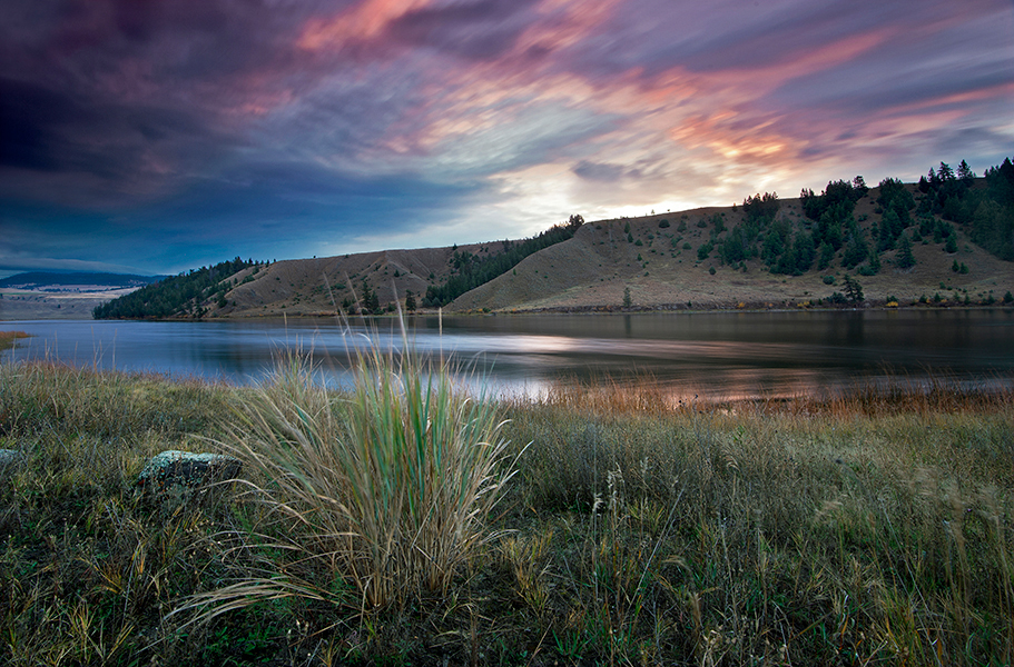 Kelly Funk Trapp lake moody sunrise A moody early morning sky creates a dramatic effect over Trapp Lake on a beautiful fall morning south of Kamloops in the Thompson Okanagan region of British Columbia Canada, available as a large-scale corporate print or commercial stock image by Kelly Funk Photography.