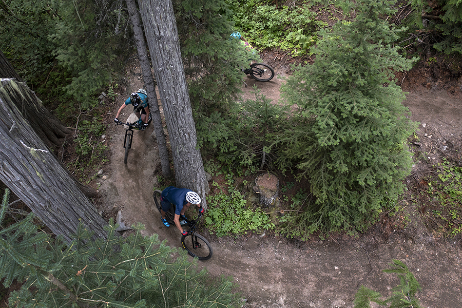 Kelly Funk aerial sport photography Mountain bikers captured by Kelly Funk Photography navigate the new trail system on the south side of Sun Peaks Resort in the Thompson Okanagan region of British Columbia, Canada.
